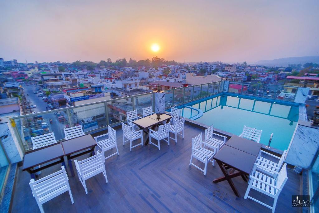 Hotel Holy Vivasa Rishikesh [Ariya Hotel's Rooftop Restaurant With Scenic Views And Dining Setup]