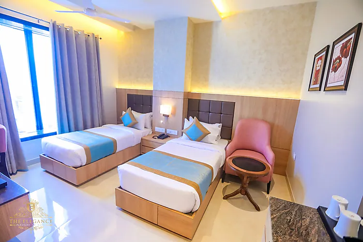 The Elegance Hotel Varanasi Varanasi [Simple Sitting Area With A Chair And Table In Standard Room]